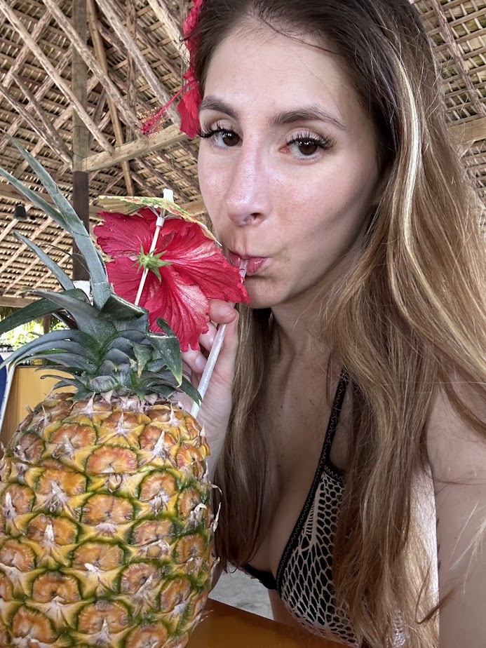 Me drinking at the Chukka Ocean Outpost restaurant