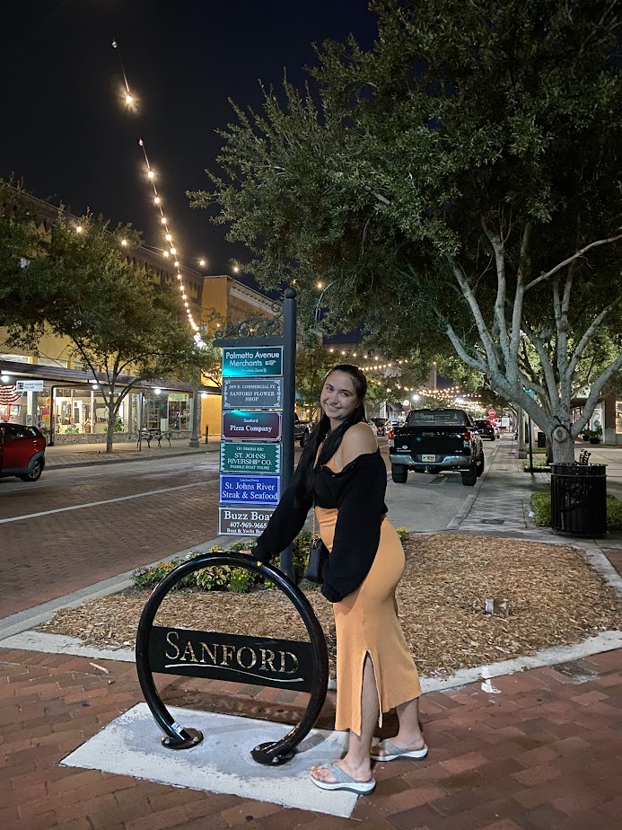 Katie standing on the street of Sanford, one of the most charming towns near Orlando