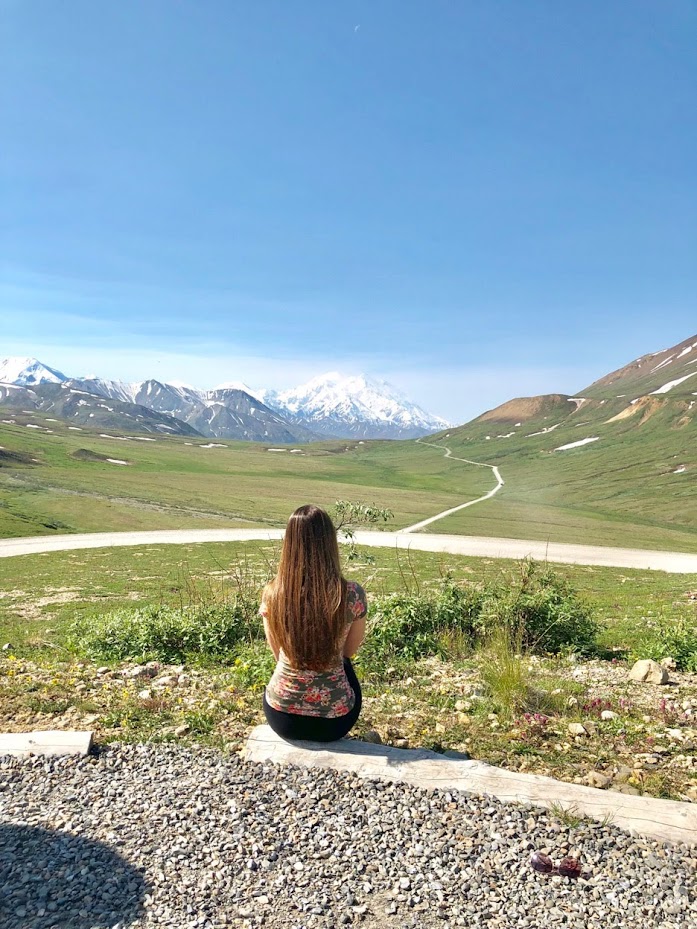 Picture of me in Denali National Park in Alaska. My most important Alaska cruise tip is to book a land package to visit the park.