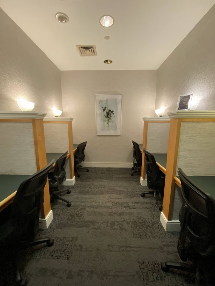 Room with desks in the Delta Sky Club in Orlando