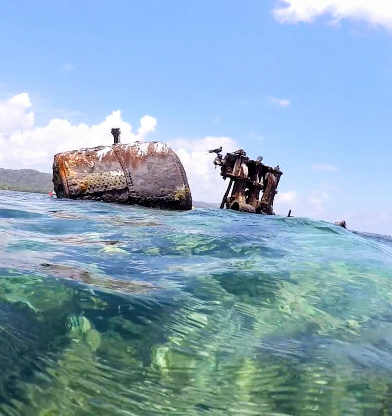 The SNYG shipwreck above water in Roatan, Honduras