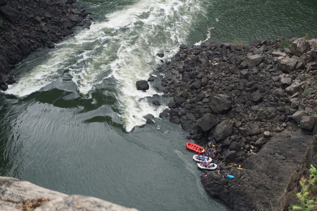 An important tip for visiting Victoria Falls, Zimbabwe, is to be aware that water activities may be dangerous. This is a picture of white water rafting in the Zambezi river.