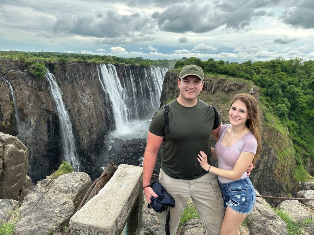 An important Victoria Falls travel tip is that you will get wet at the falls. In this photo of my husband and I, you can see we are soaked.